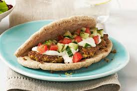 Falafel in pita with tomato and cucumber
