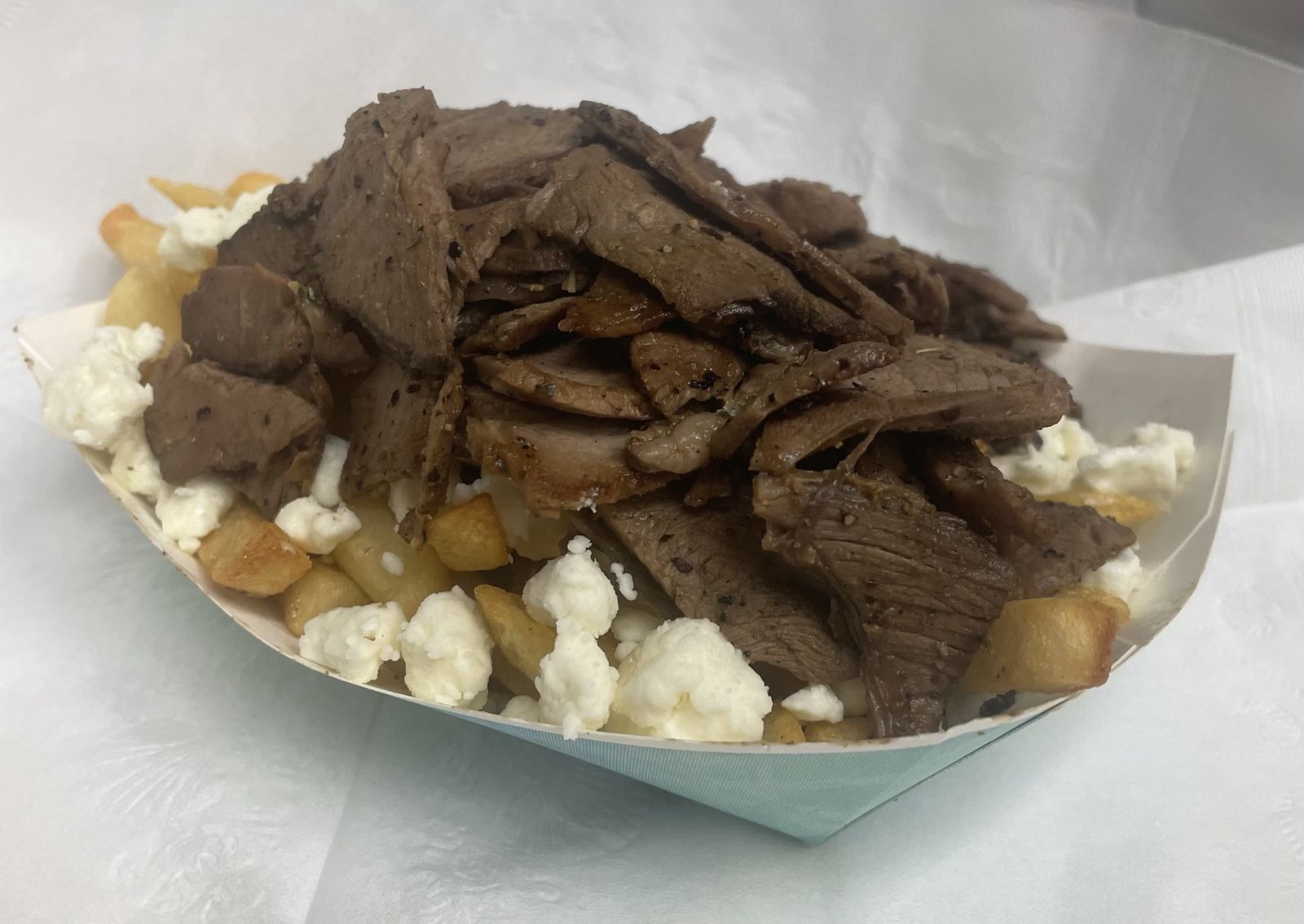 Opa fries — lamb over fries and feta